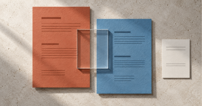 Rust and steel-blue paper record panels overlap a clear rectangular window, with a separate pale panel on a stone surface.